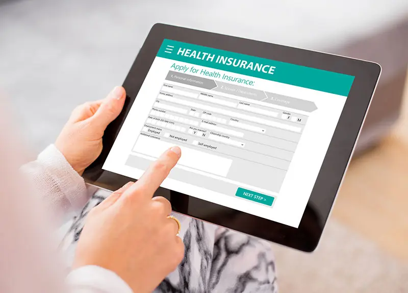 Reviewing an insurance verification form on a tablet
